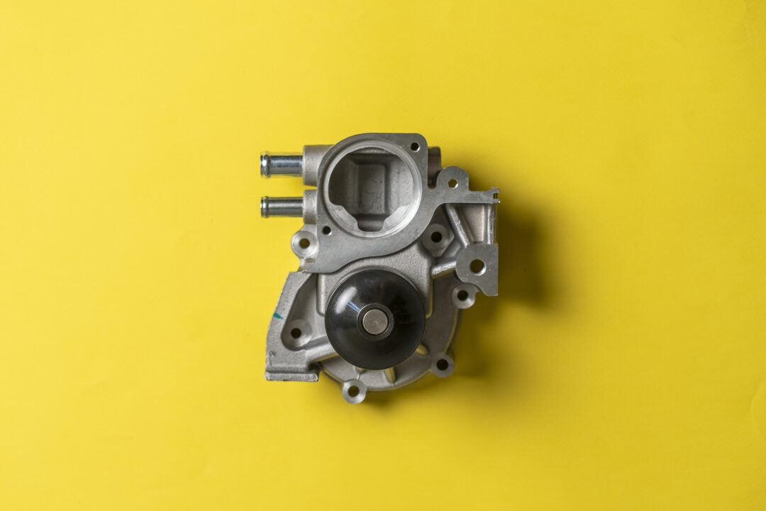 a brand new car engine water pump motor isolated